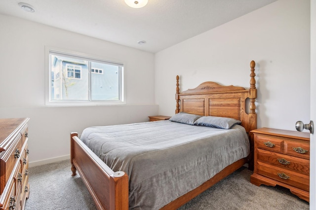 carpeted bedroom with baseboards