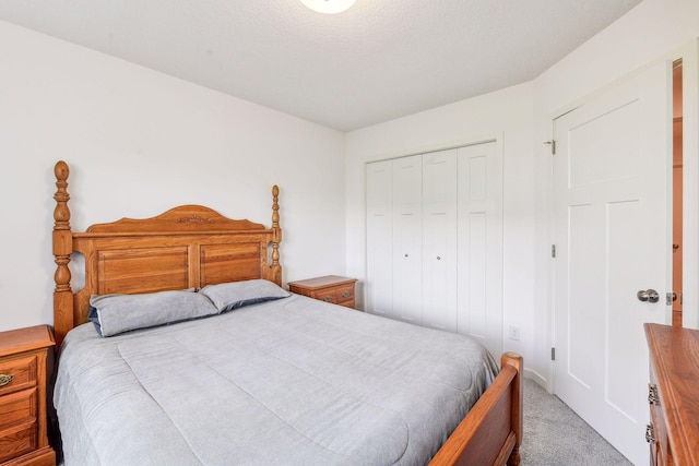 carpeted bedroom with a closet