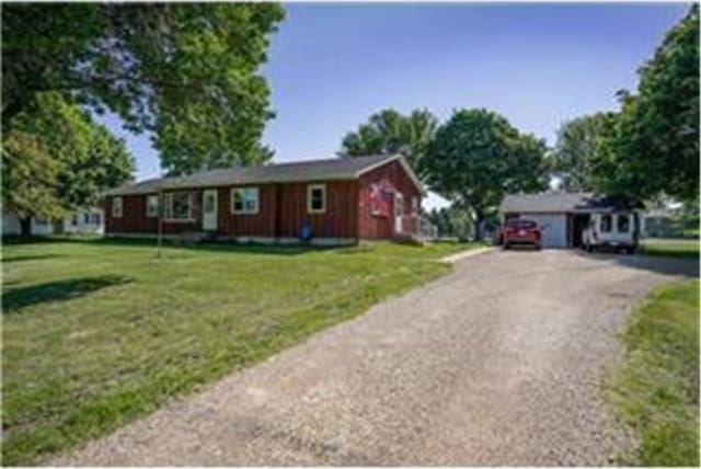 ranch-style home with a front yard