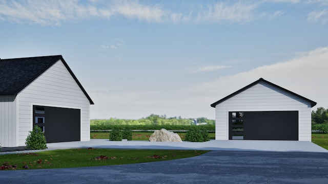 exterior space with a garage and an outdoor structure