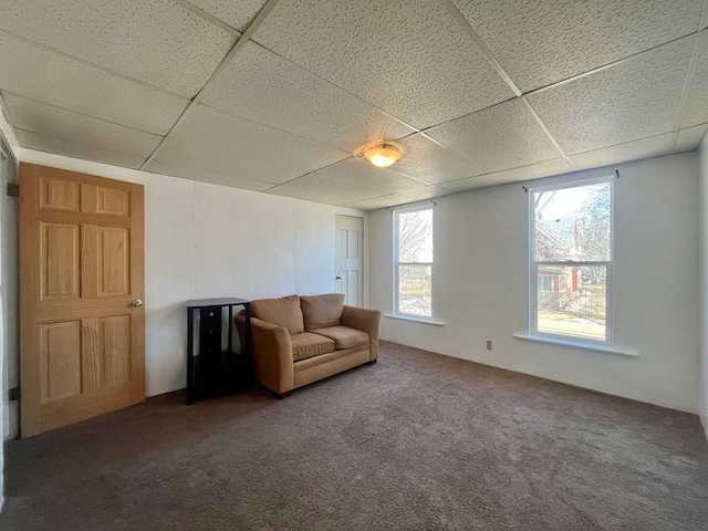 unfurnished room featuring carpet floors and a paneled ceiling