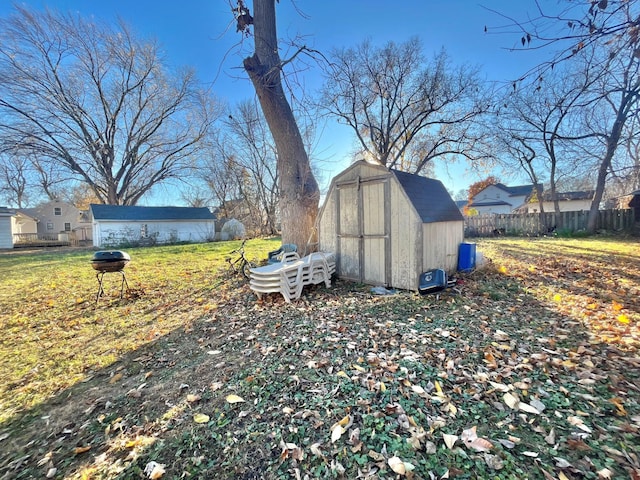 view of shed featuring fence