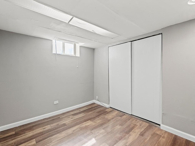 basement featuring wood-type flooring