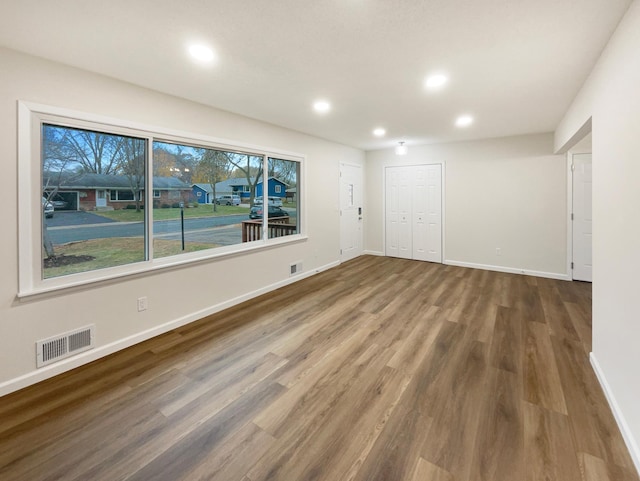 unfurnished room featuring dark hardwood / wood-style flooring