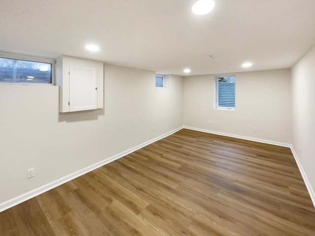 basement featuring hardwood / wood-style floors