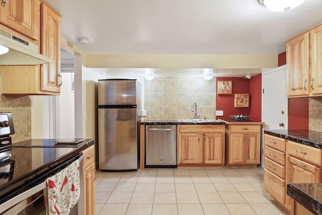 kitchen featuring decorative backsplash, sink, light tile patterned flooring, and stainless steel appliances