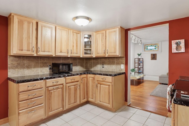 kitchen featuring decorative backsplash, light tile patterned floors, light brown cabinets, and rail lighting