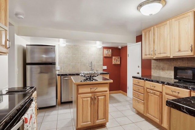 kitchen featuring a center island, light tile patterned floors, stainless steel appliances, and tasteful backsplash