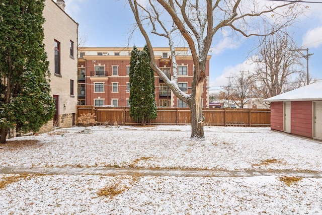 view of yard layered in snow