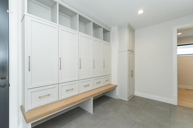 mudroom with tile patterned floors