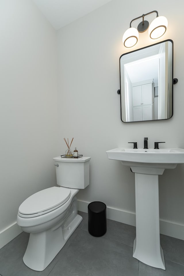 bathroom featuring tile patterned floors and toilet