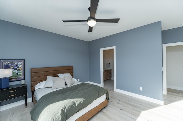 bedroom with connected bathroom, ceiling fan, and light wood-type flooring