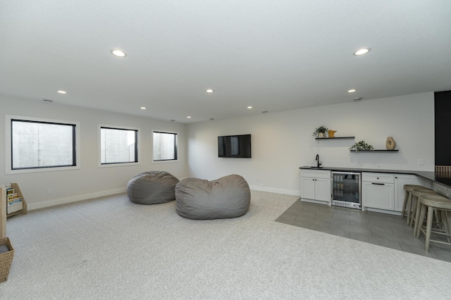 tiled living room featuring wet bar and wine cooler