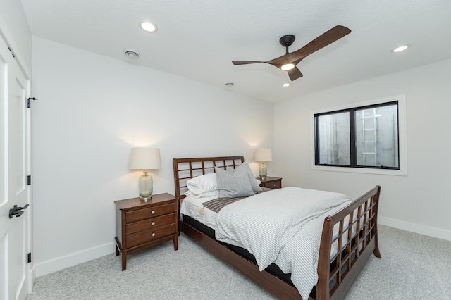 bedroom featuring light carpet and ceiling fan