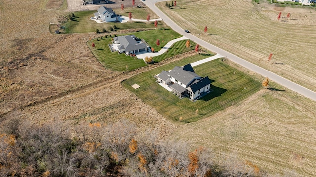 birds eye view of property featuring a rural view