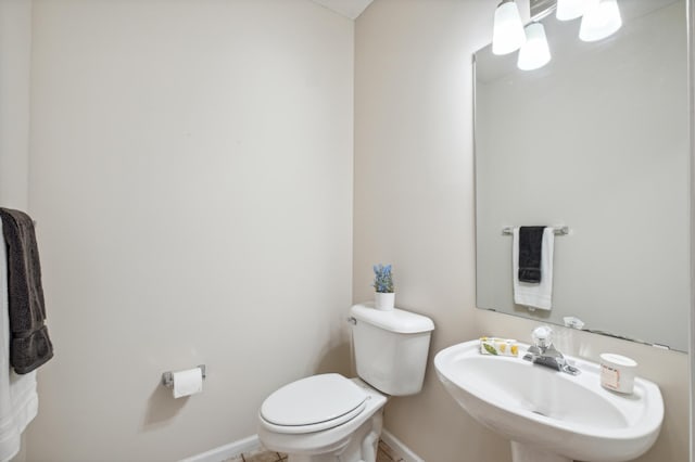 bathroom featuring sink and toilet