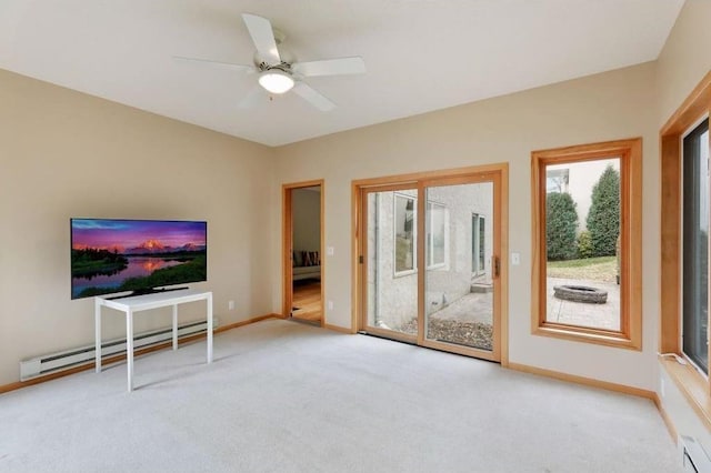 unfurnished living room featuring light colored carpet, baseboard heating, and ceiling fan