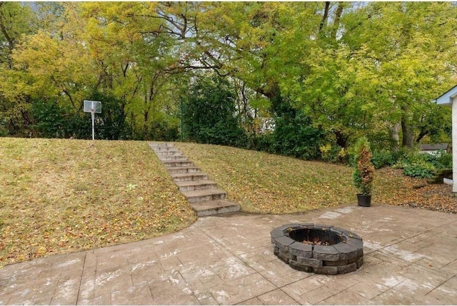 view of patio / terrace with an outdoor fire pit