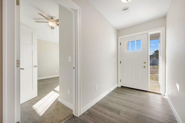 foyer entrance featuring light wood-type flooring and ceiling fan