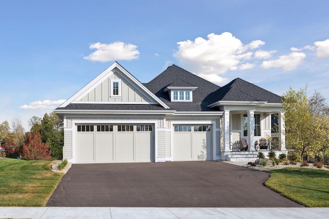 craftsman-style house with a front lawn and a porch