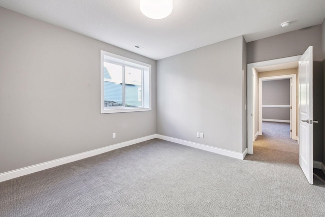 spare room with carpet floors