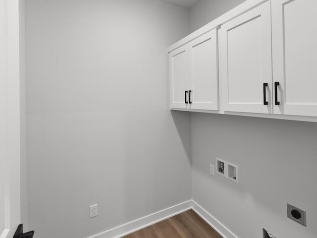 laundry room with cabinets, electric dryer hookup, washer hookup, and dark hardwood / wood-style flooring