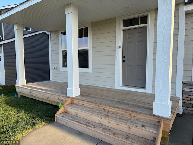 doorway to property with a porch