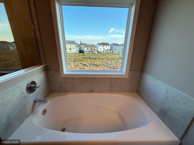 bathroom with a tub