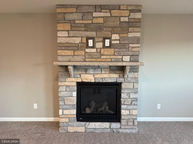 details featuring carpet flooring and a fireplace