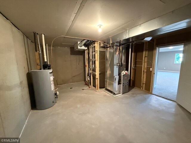 basement featuring heating unit and water heater