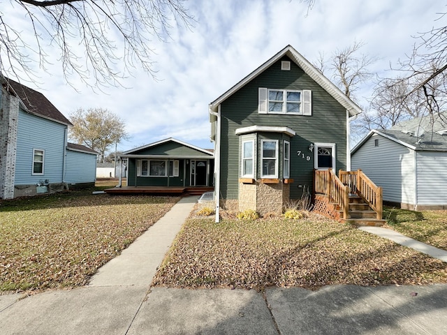 view of front of house with a front lawn and a porch