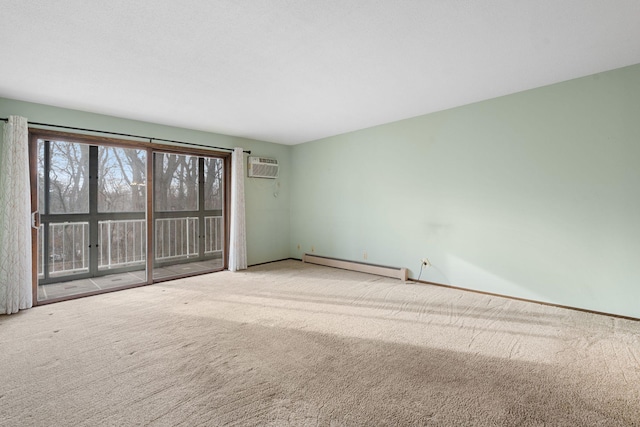 carpeted spare room with a wall unit AC and baseboard heating