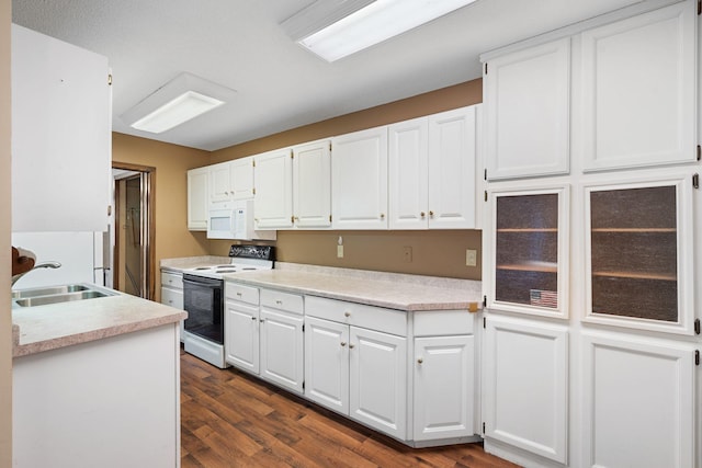 kitchen featuring dark hardwood / wood-style floors, white cabinetry, white appliances, and sink