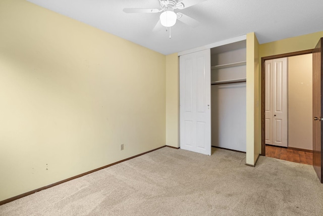 unfurnished bedroom with light carpet and ceiling fan