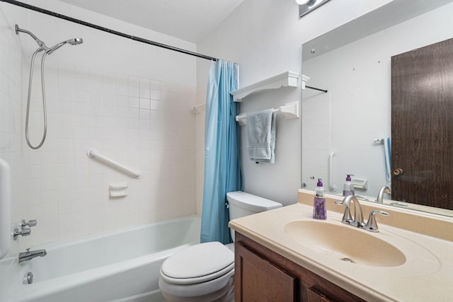 full bathroom with vanity, shower / bath combination with curtain, and toilet