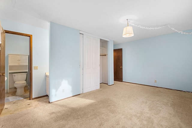 unfurnished bedroom featuring light colored carpet