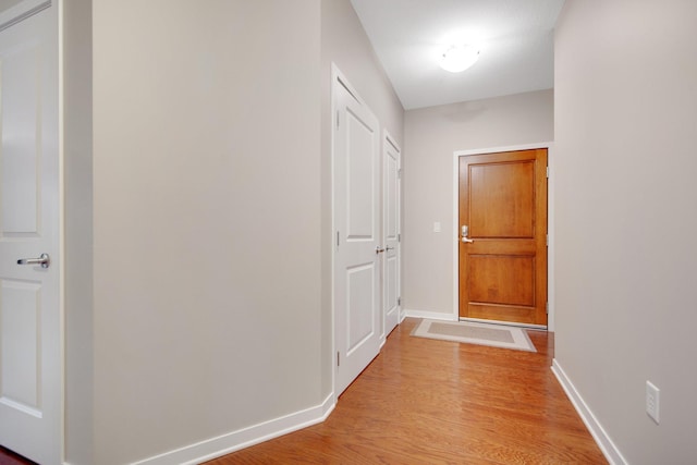 hall with light wood-type flooring