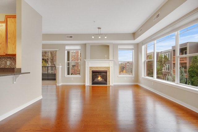 unfurnished living room featuring wood-type flooring