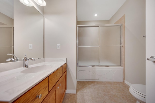 full bathroom with tile patterned floors, shower / bath combination with glass door, vanity, and toilet