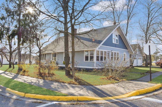 132 6th St NE, Crosby, MN 56441 - view of front of property featuring roof with shingles and a front yard