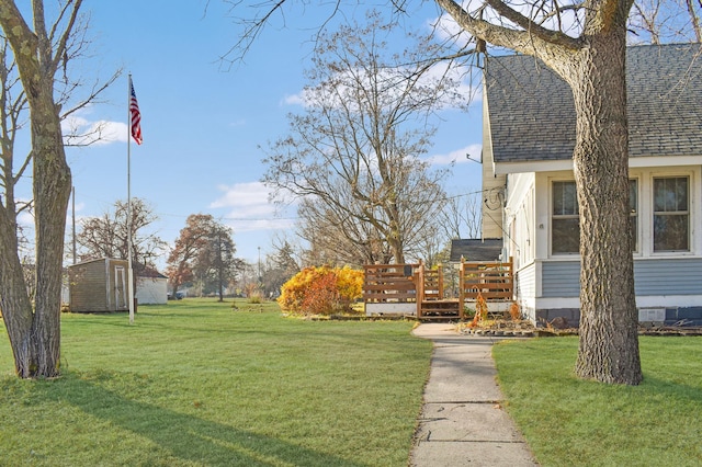 view of yard with a wooden deck