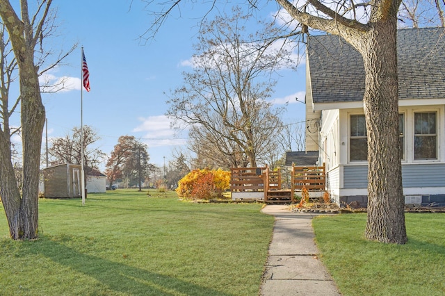 132 6th St NE, Crosby, MN 56441 - view of green lawn with a wooden deck