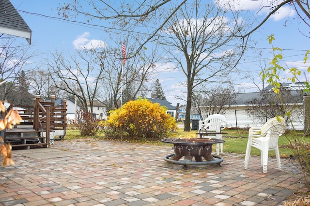 view of patio / terrace with an outdoor fire pit