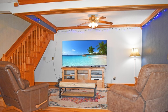 living room with wood-type flooring and ceiling fan