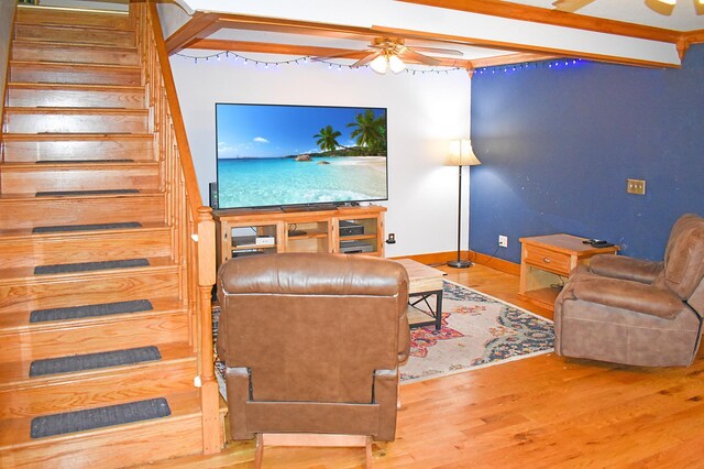 132 6th St NE, Crosby, MN 56441 - living area with ceiling fan, wood finished floors, stairway, and baseboards