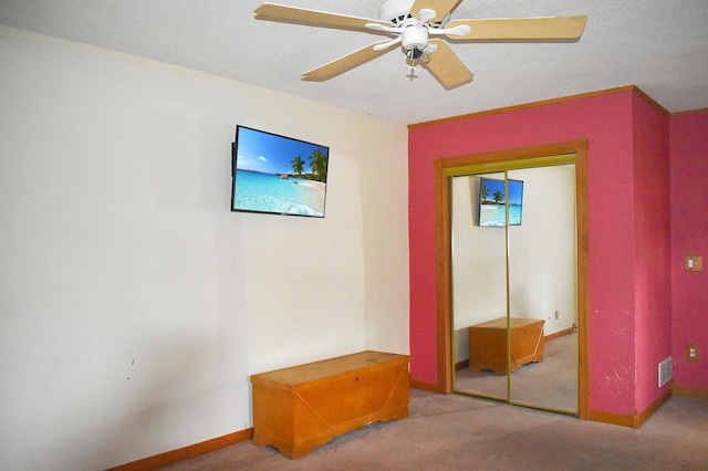 bedroom with carpet floors, a closet, and ceiling fan