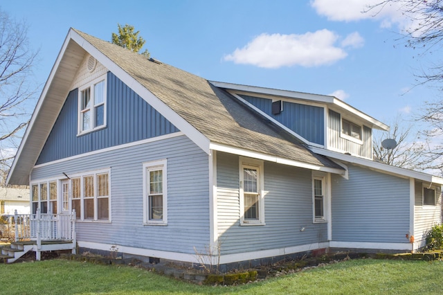 back of house with a yard