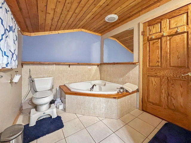 bathroom with lofted ceiling, tile patterned floors, a relaxing tiled tub, toilet, and wood ceiling