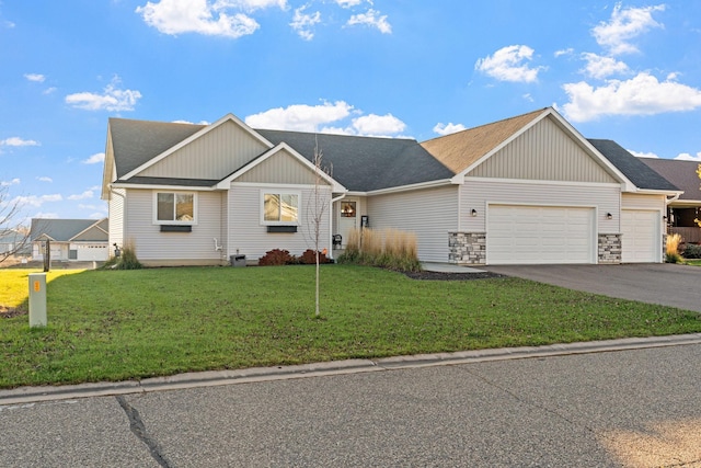 view of front of house featuring a front lawn and a garage