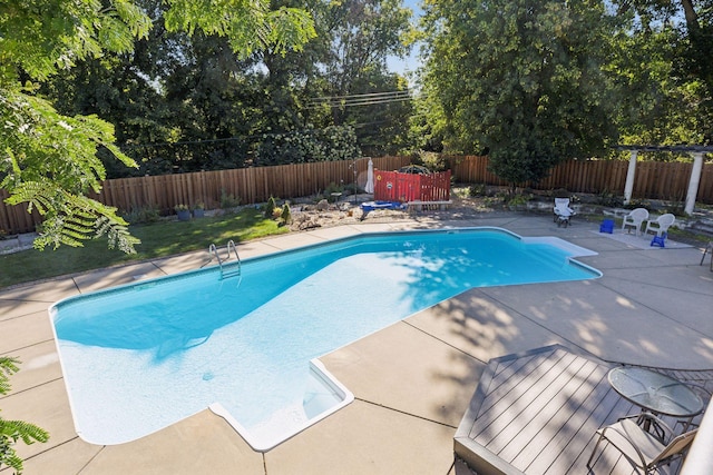 view of swimming pool with a patio, a fenced backyard, and a fenced in pool